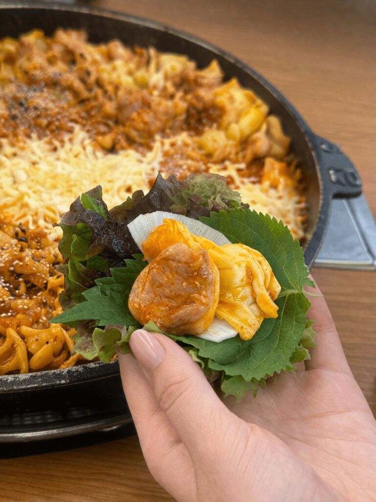 Korean dakgalbi lettuce wrap with chicken, kimchi, and perilla leaf in Jongno Seoul