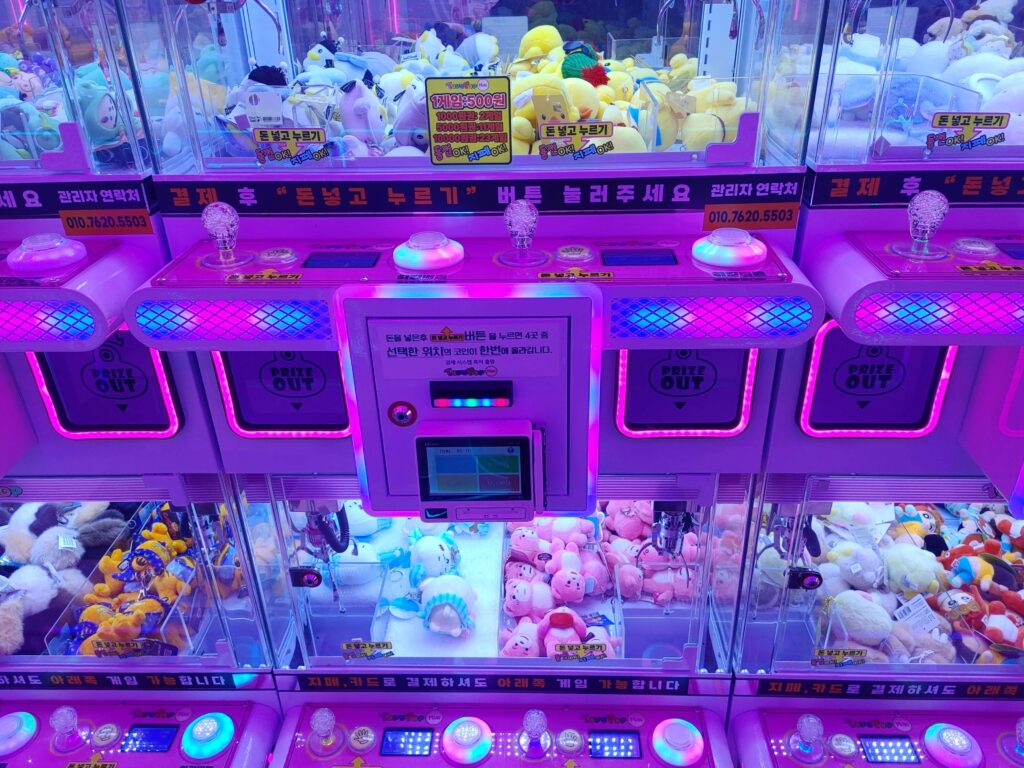 Clean and modern claw machines with plush toys in Seoul arcade