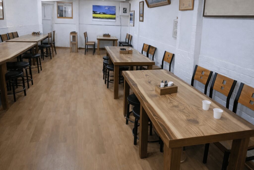 Interior of Daeseongjip restaurant in Jongno with simple wooden tables
