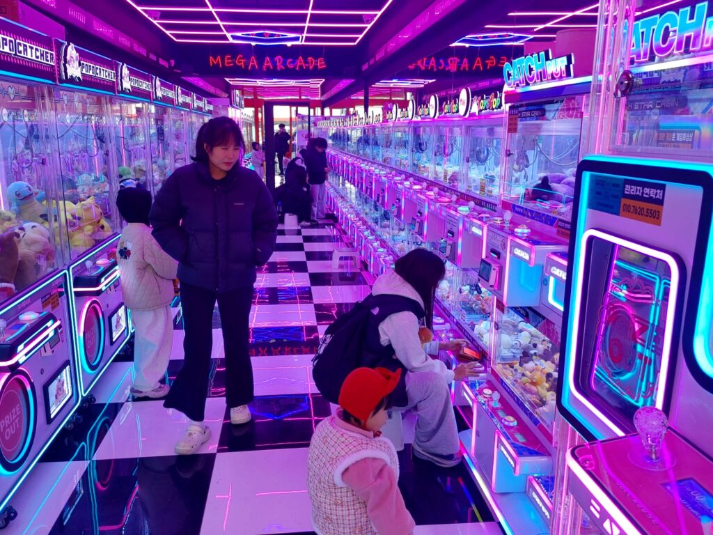 Claw machine arcade with neon lights in Jongno Seoul