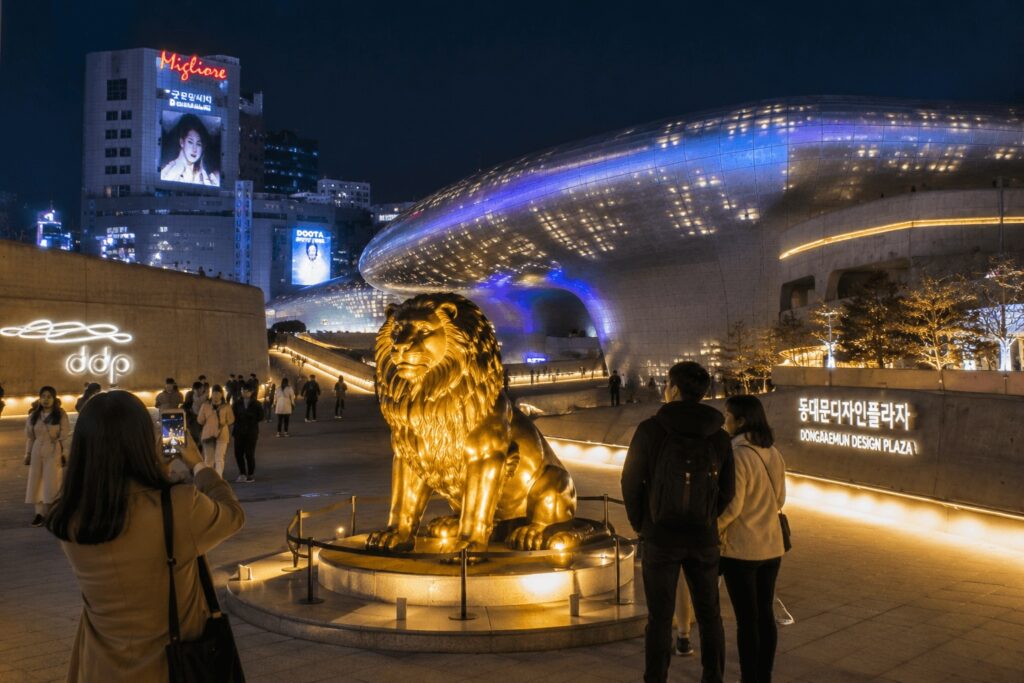 Golden lion statue photo spot at Dongdaemun Design Plaza Seoul at night