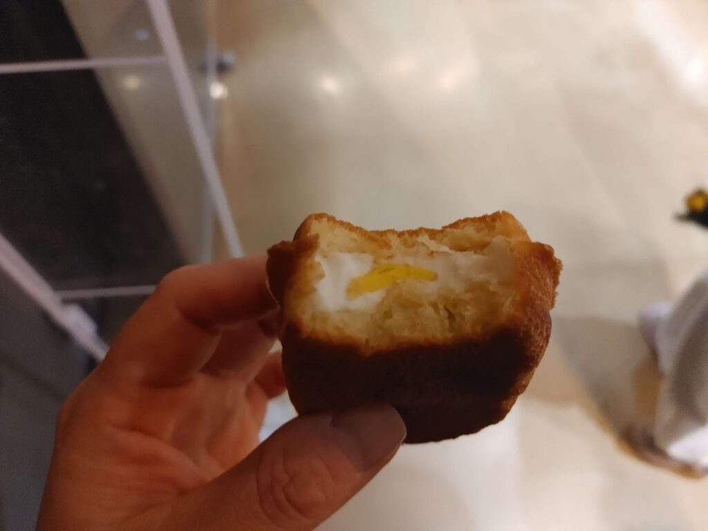 One bite of Korean egg bread street snack in Seoul Korea