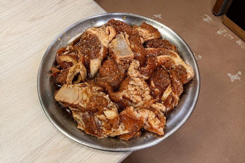 Marinated raw pork galbi prepared at Meoksoe Jip in Jongno Seoul