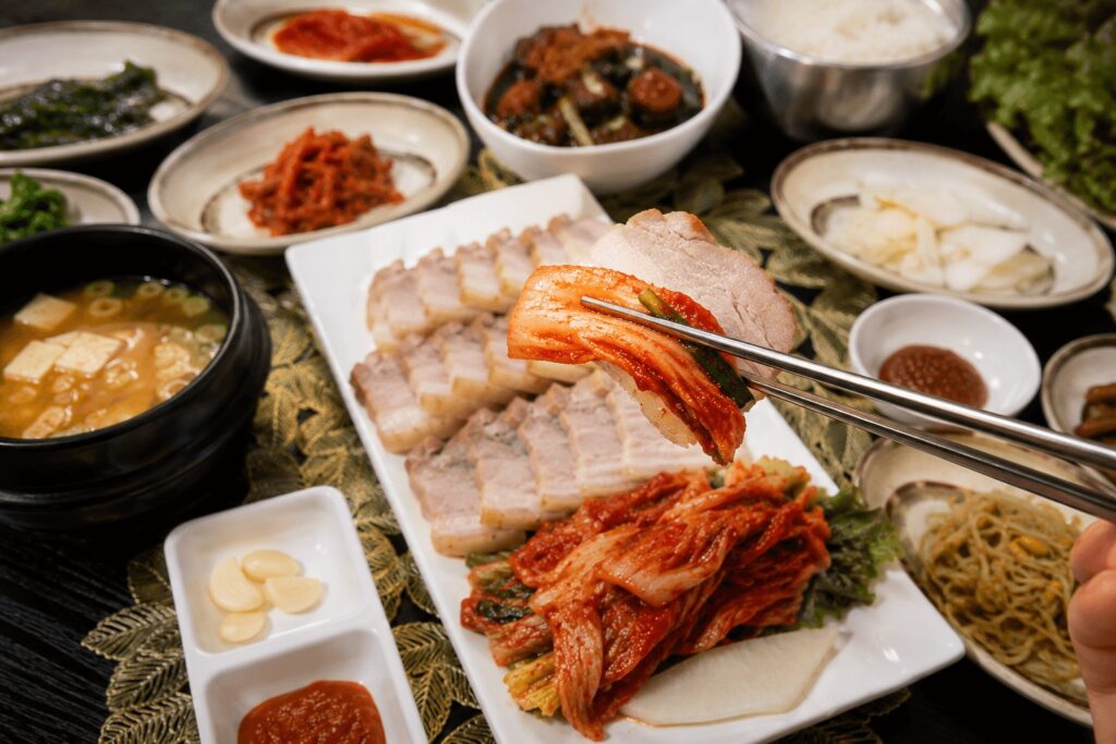 Close-up of bossam wrapped with kimchi at Hansangcharim Bapsang near Dongdaemun in Seoul.