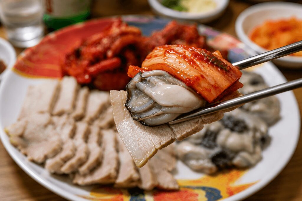 Oyster bossam wrap at Korean bossam restaurant Samhaejip in Seoul