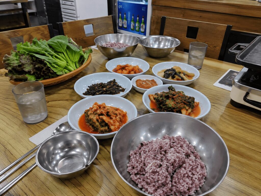 Korean banchan side dishes served with kimchi stew in Jongno Seoul