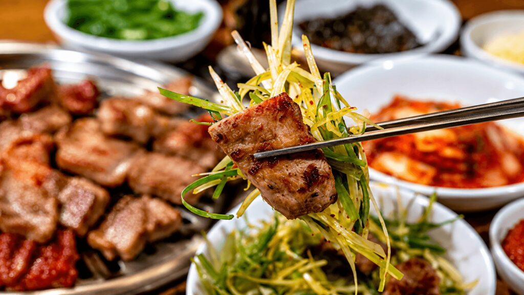 Grilled Korean pork galbi with seasoned green onion salad