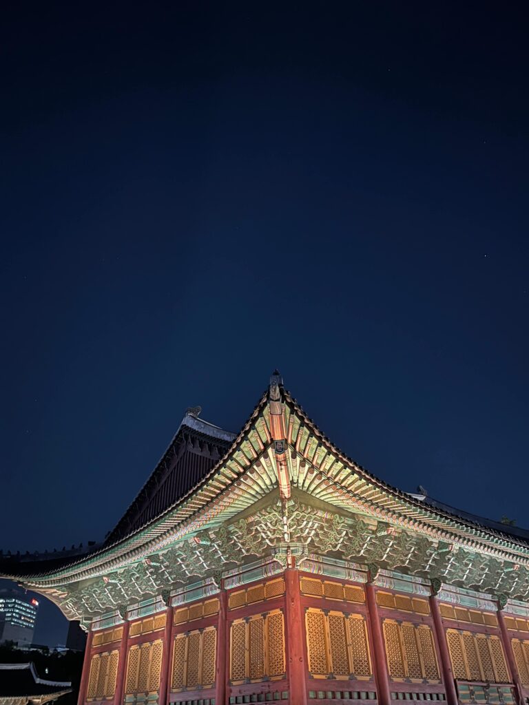Traditional pavilion at Deoksugung illuminated during the night opening