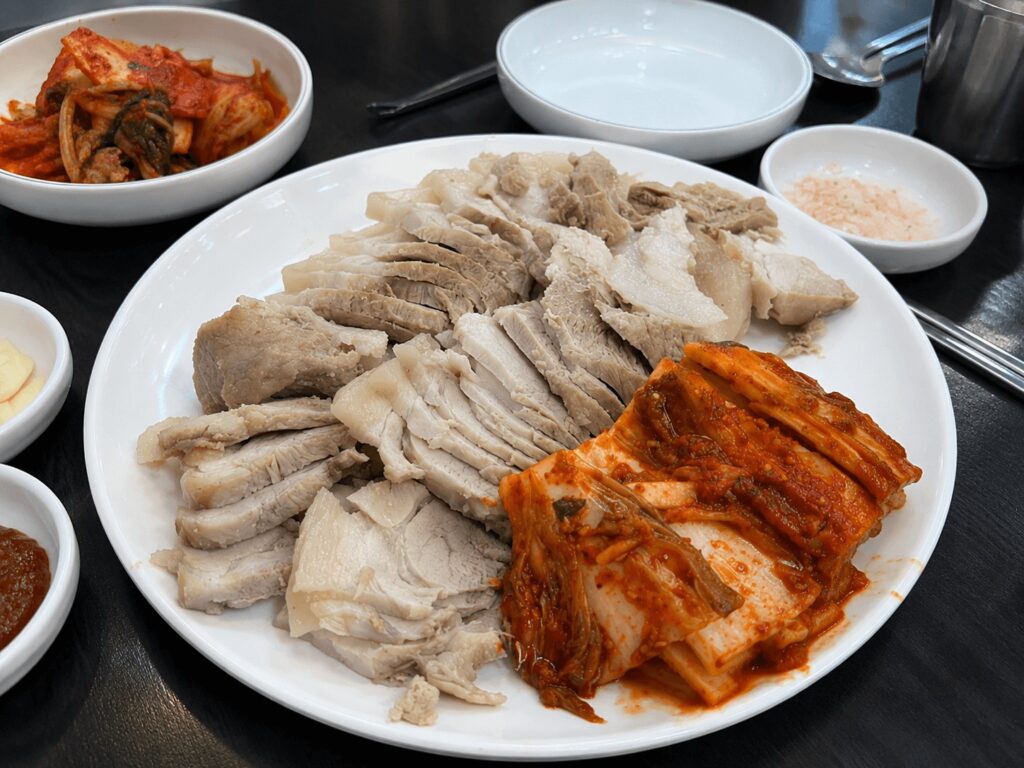 Steamed pork bossam with fresh kimchi at Family Son Kalguksu Bossam in Seongsu