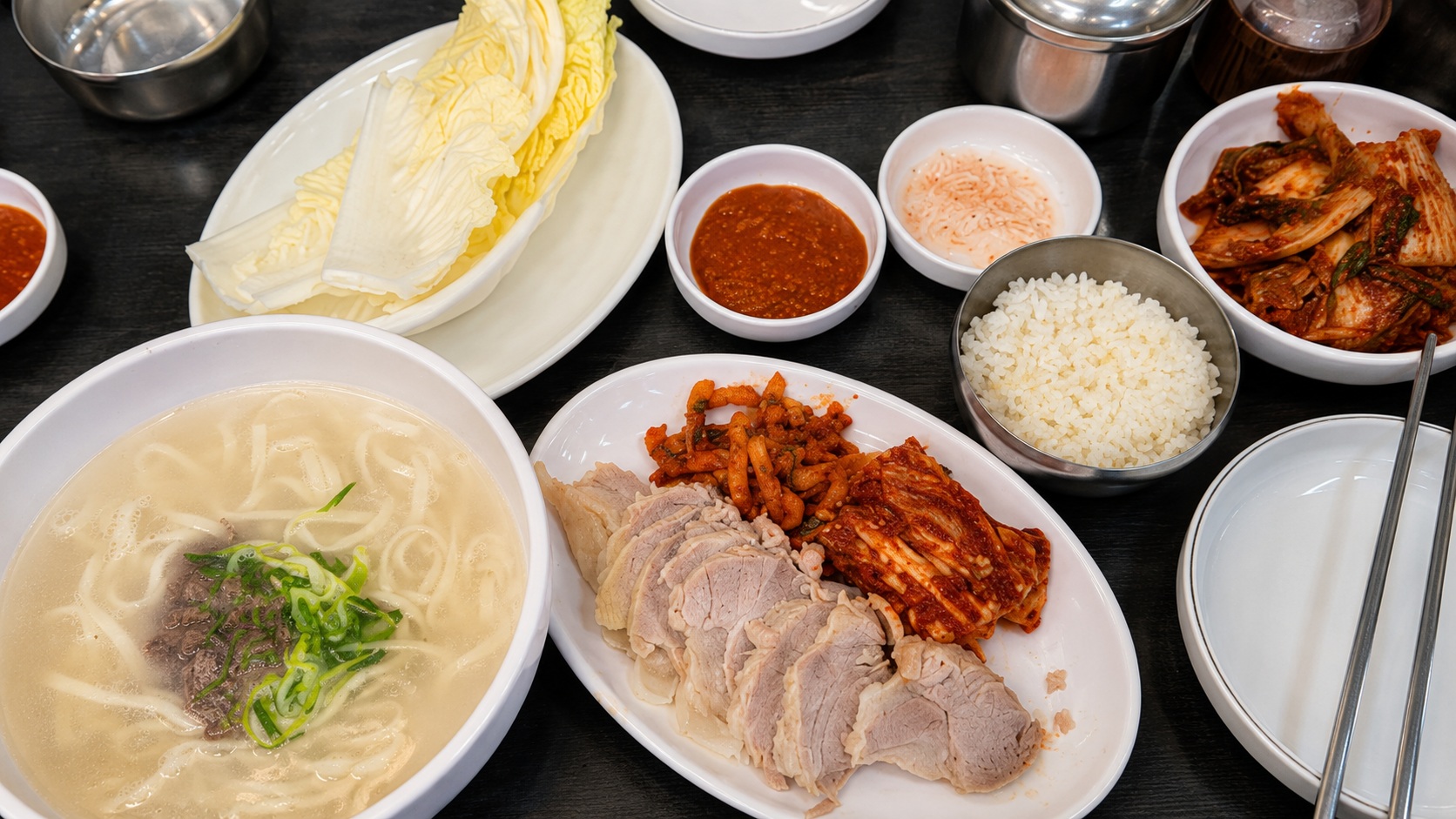 Bossam set meal with handmade kalguksu, rice, kimchi, and napa cabbage at Family Son Kalguksu Bossam in Seongsu