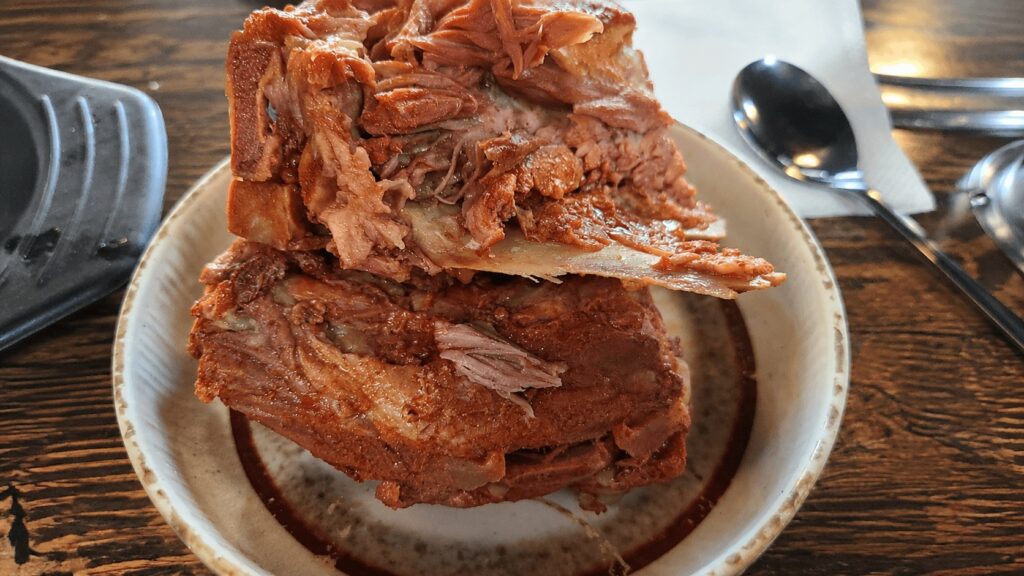 Close-up of pork backbone meat from gamjatang in Seongsu