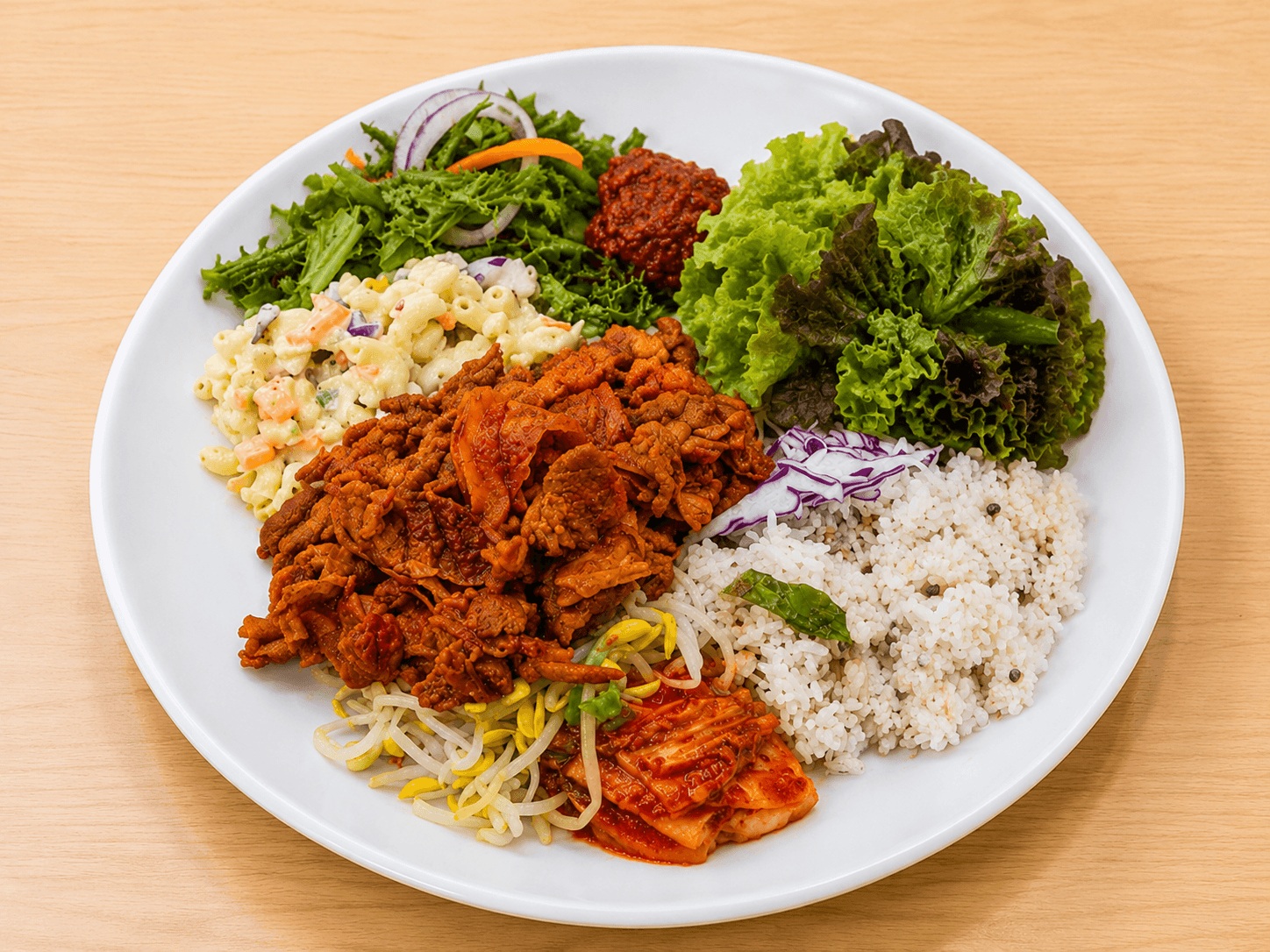 Korean buffet plate with spicy stir-fried pork, rice, salad, and side dishes at Seongsu Jeongchan Korean Buffet