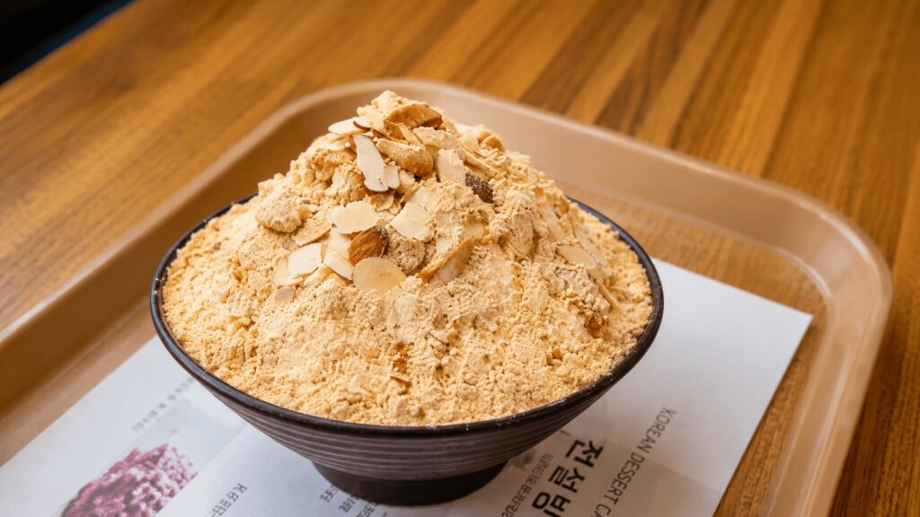 Signature Injeolmi Bingsu at Sulbing Seongsu topped with soybean powder and almonds