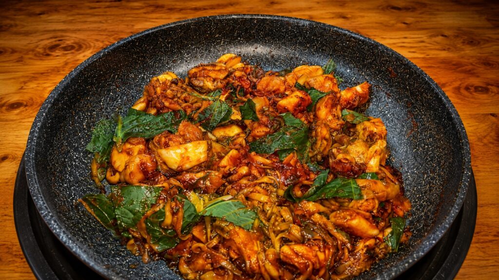 Spicy Korean dakgalbi stir-fried chicken with vegetables near Seongsu