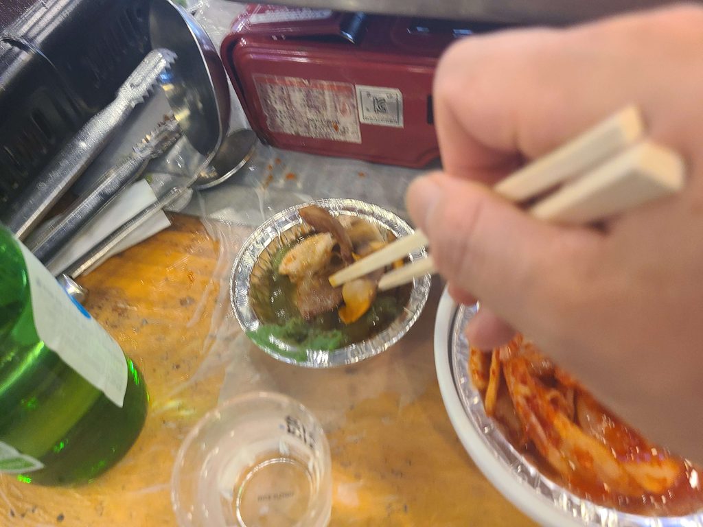 Cooked shellfish and pork at a Korean seafood restaurant