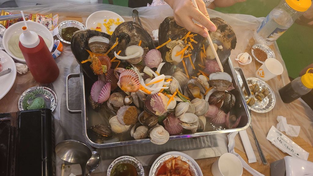Large Korean shellfish platter with clams and scallops