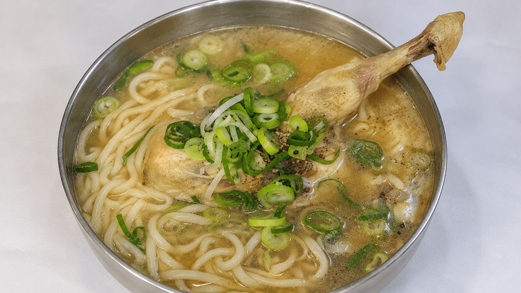 Korean chicken kalguksu noodle soup with chicken leg in Myeongdong