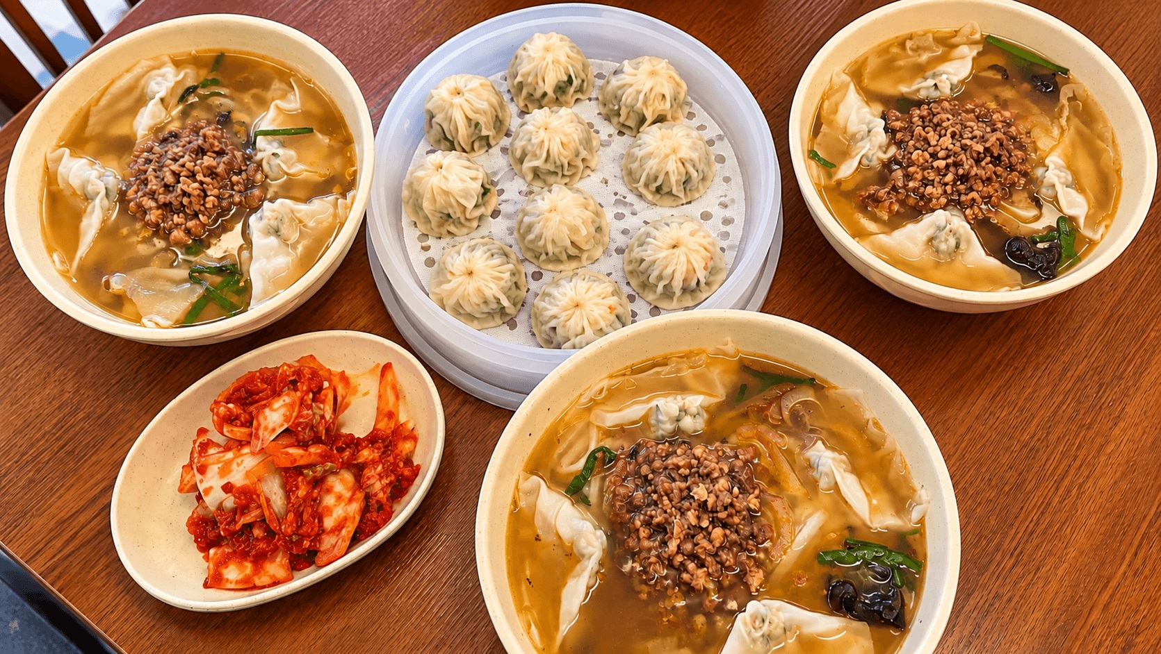 Three-person meal with kalguksu, mandu and kimchi at Myeongdong Kyoja in Seoul