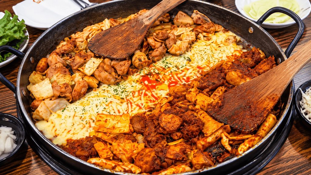 Yoogane half and half chicken galbi with melted cheese and spicy sauce